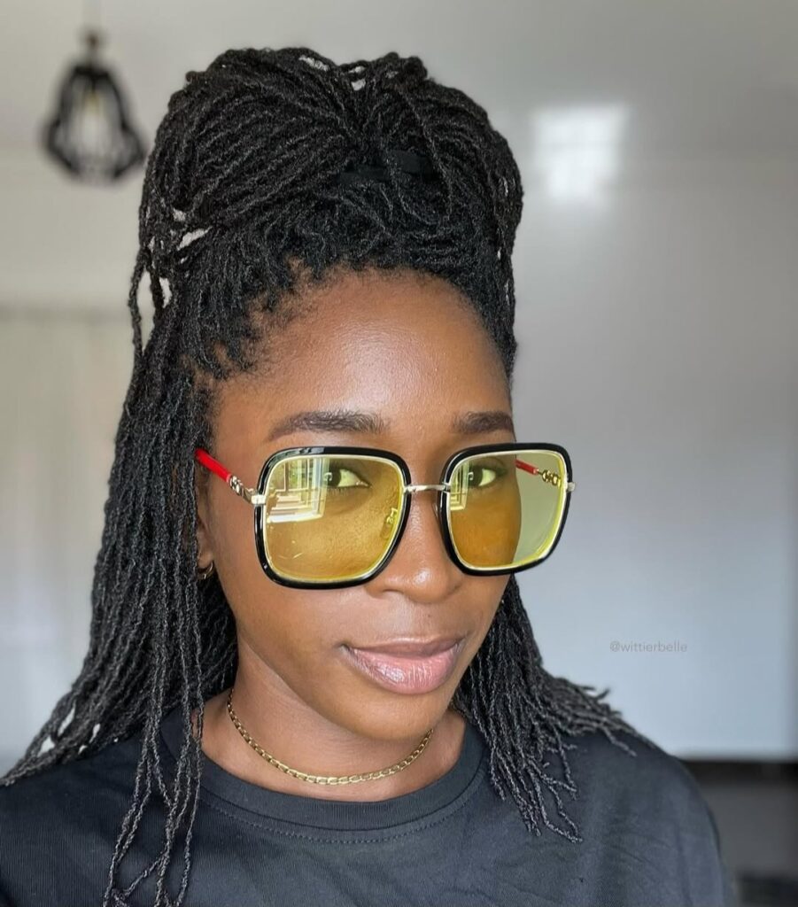 Half up, half down locs styling on woman