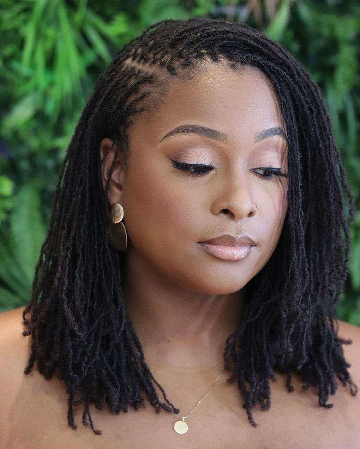 Side swept mature sisterlocs on woman