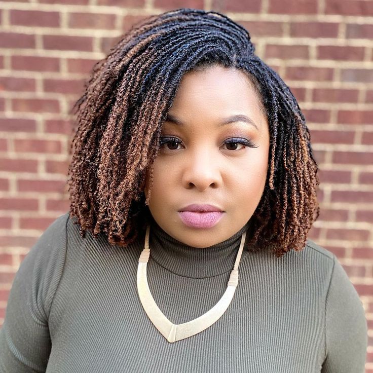 side swept microlocs on woman