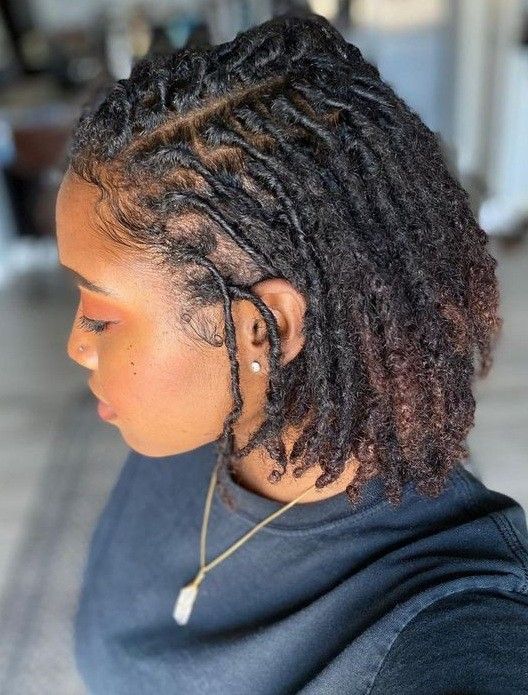 Woman on comb coils loc style