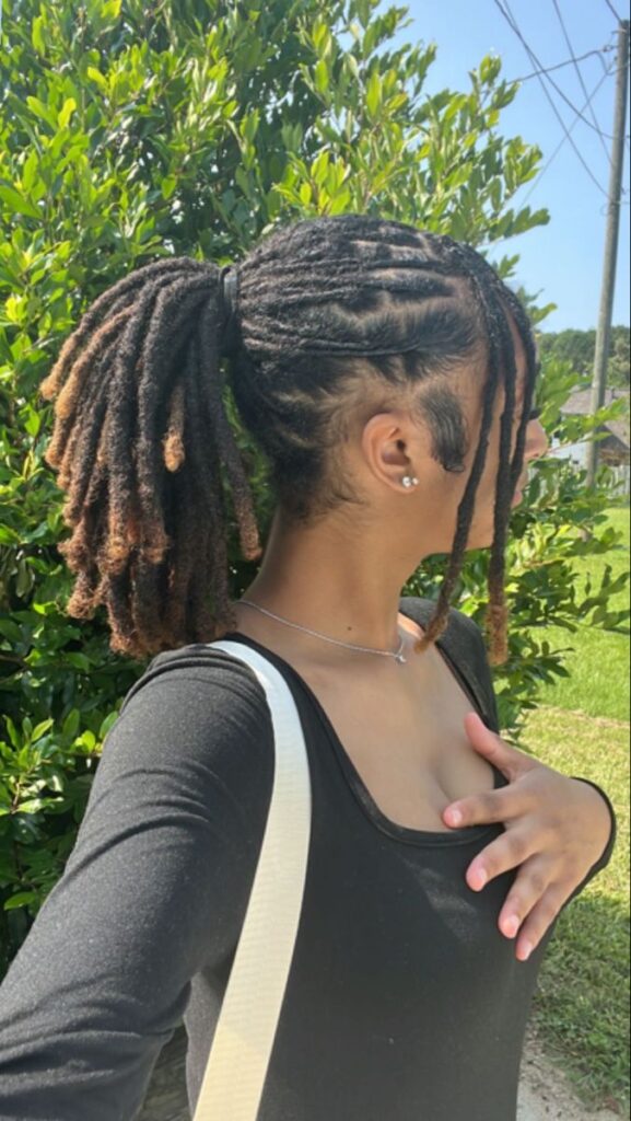 Image of a woman on locs out in summer
