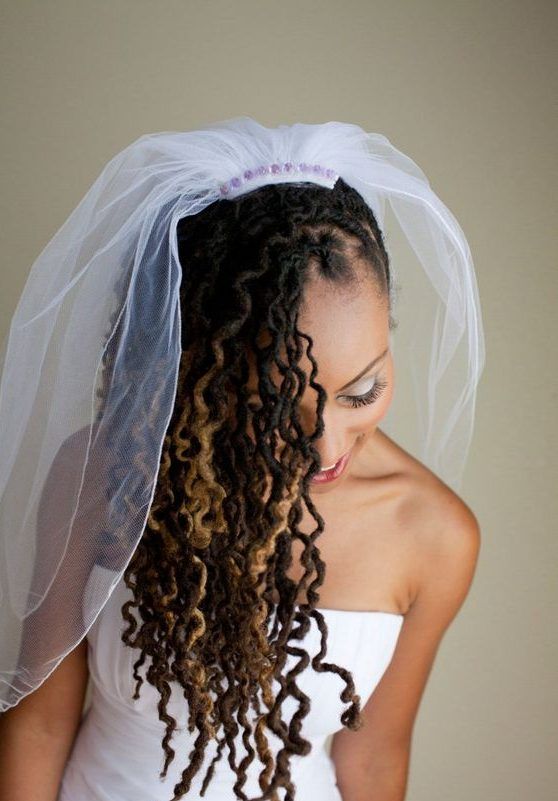 bride on locs covered with veil