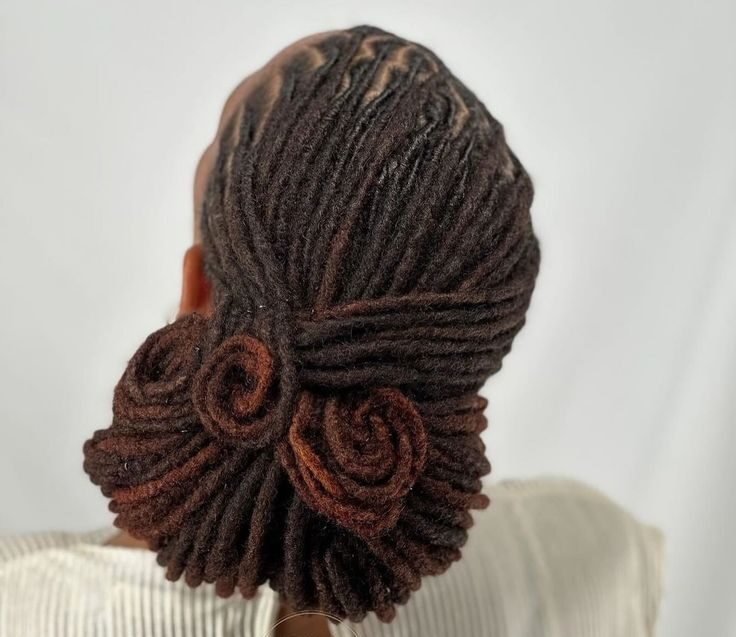 low bun locs hairstyle on woman