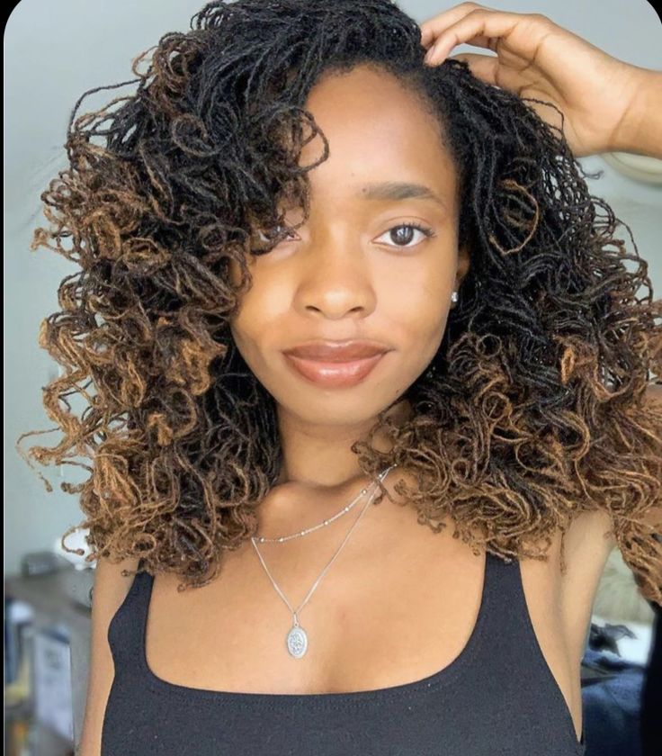 Woman on sisterlocks with curls at the tip