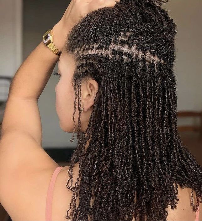 Woman on shoulder length sisterlocks