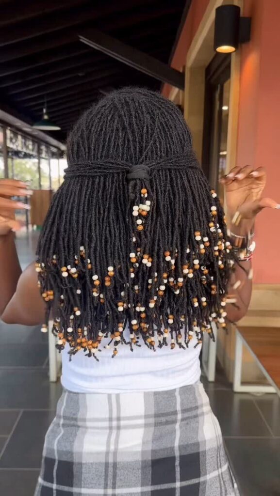 Woman on sisterlocks with beads