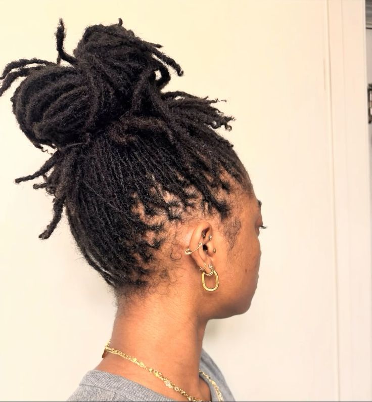 Woman on high puff locs
