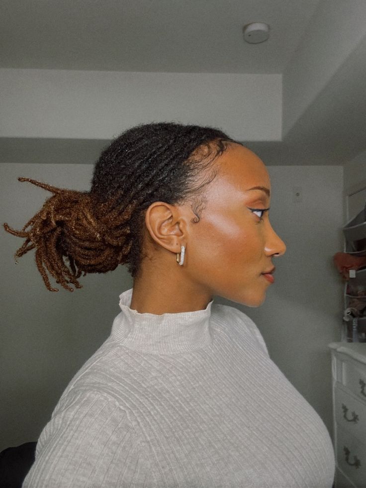 Woman on low ponytail locs