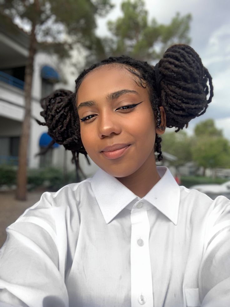 Woman on space buns locs