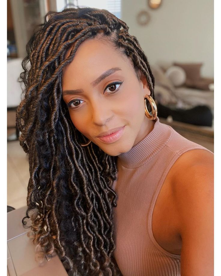 Woman on faux goddess locs