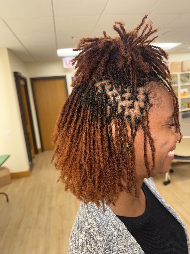 Woman on brown coloured microlocs