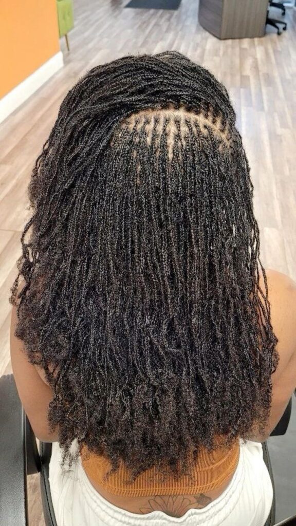 Mid length sisterlocks on woman