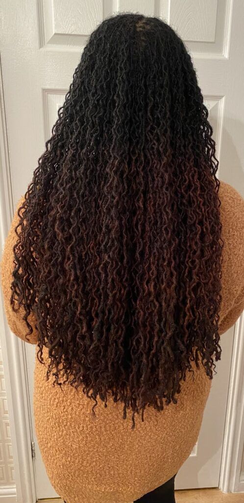 Woman on waist length sisterlocks