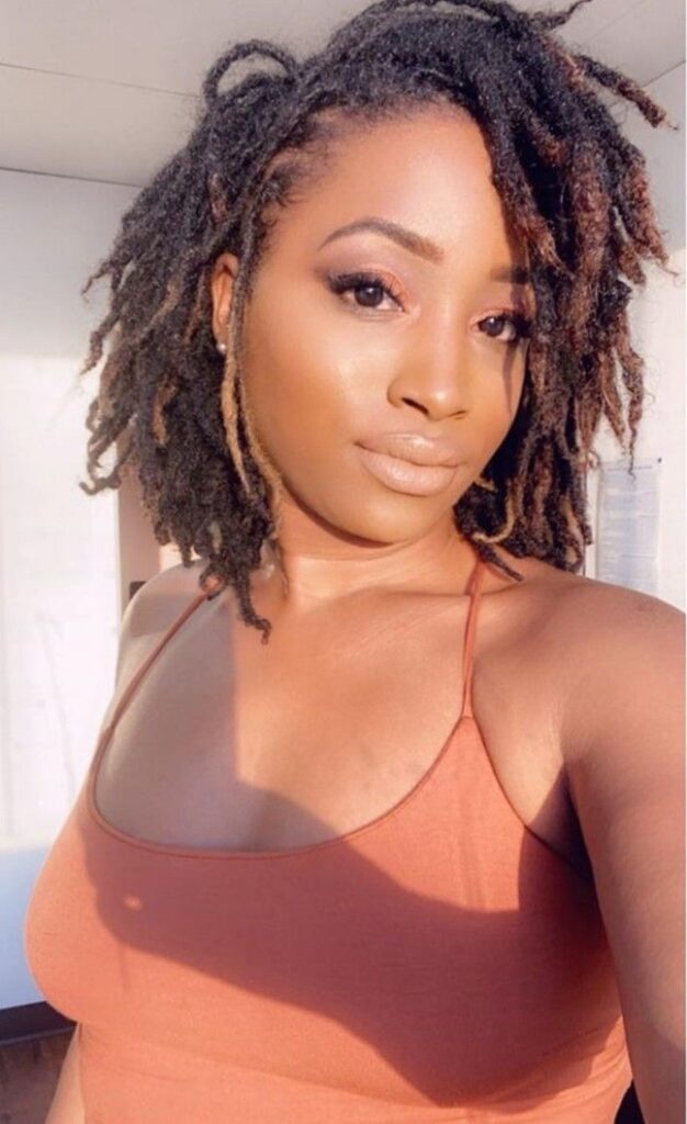 How often should you moisturize locs? Woman on traditional locs