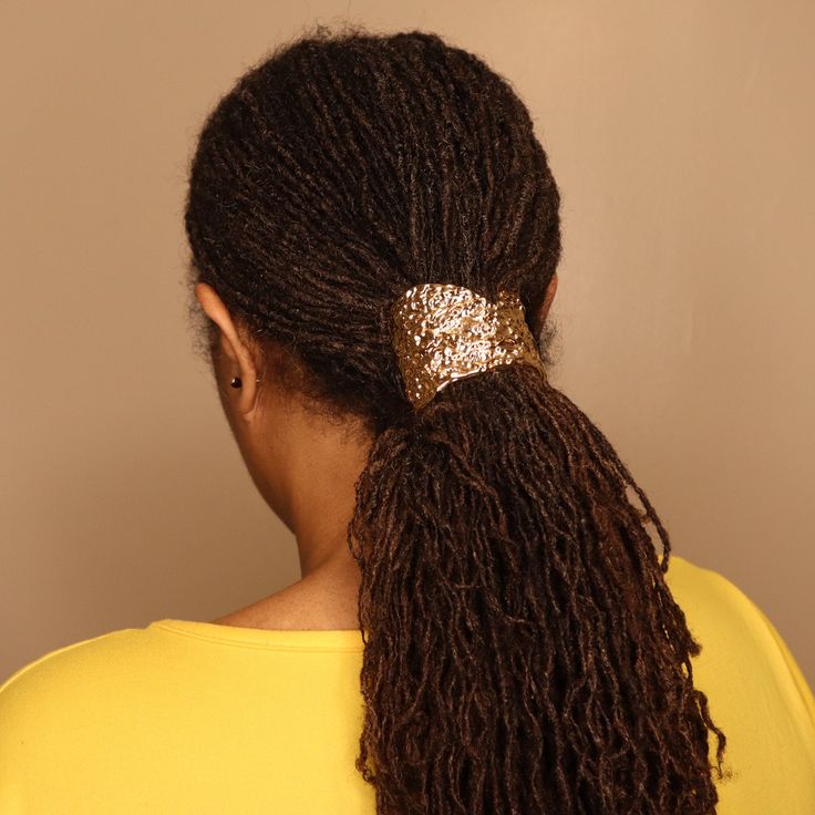 Locs with gold cuffs