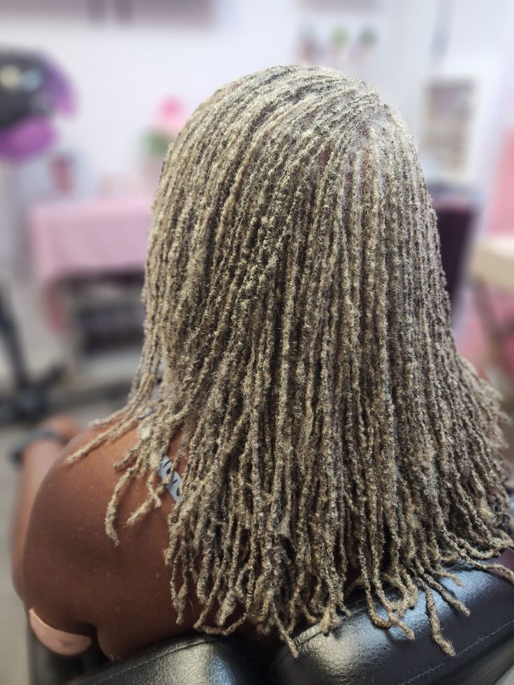 Woman on platinum blonde sisterlocks