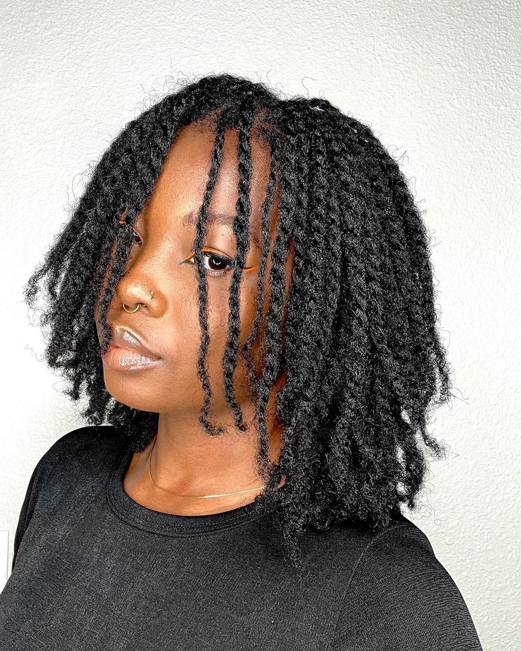 Woman on two starnd twist locs style