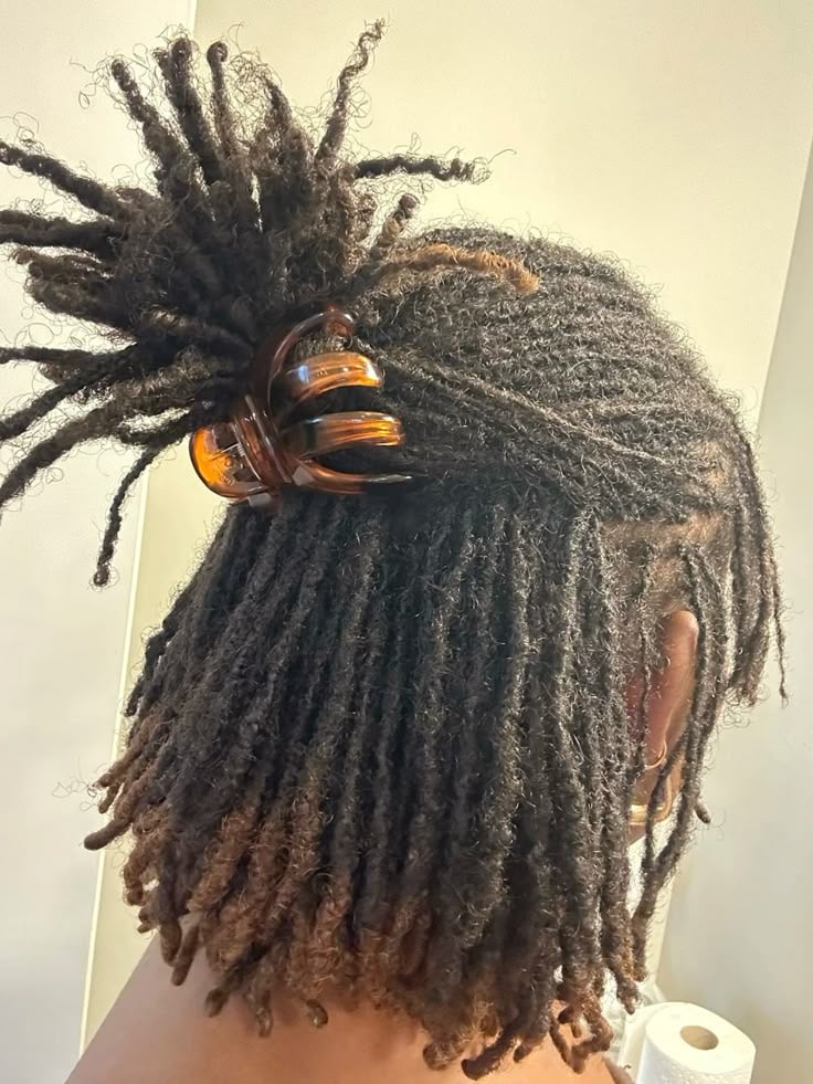 Woman on half up, half down braids starter locs