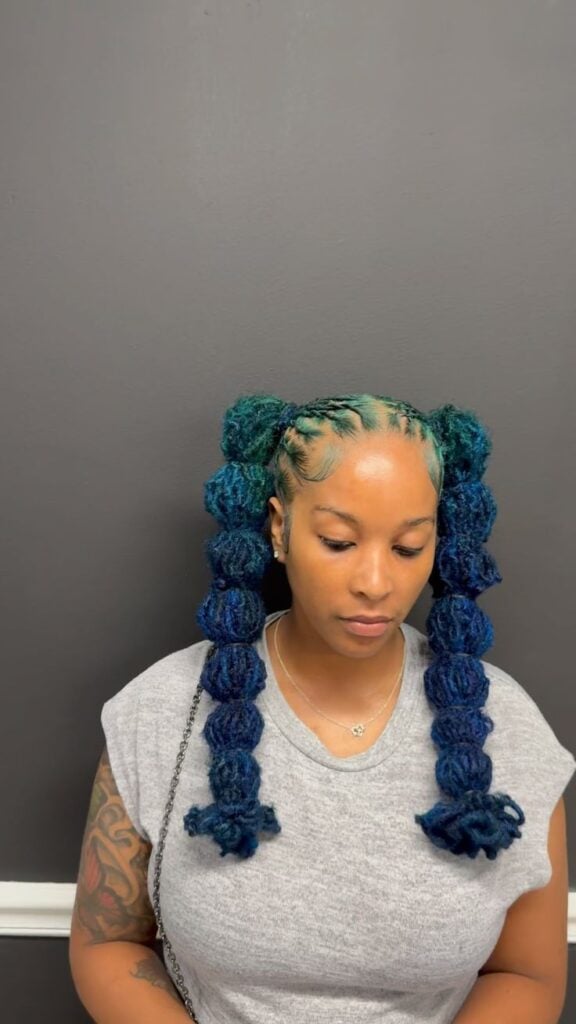 AN IMAGE OF BUBBLE PONY TAIL LOCS