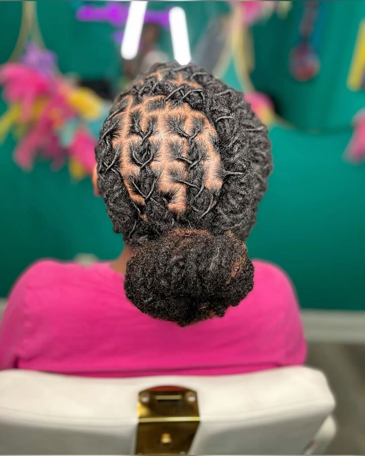 AN IMAGE OF A LADY WITH LOW KNOTTED BUN