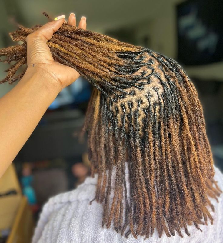 a lady on newly retwisted locs