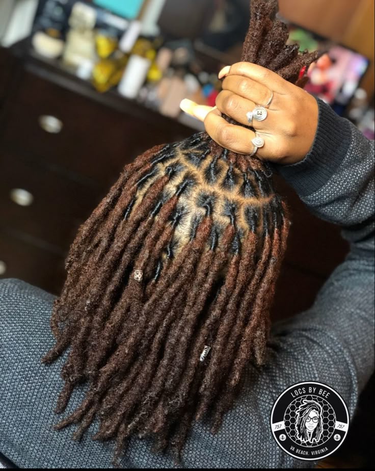 A LADY ON NEWLY RETWISTED LOCS