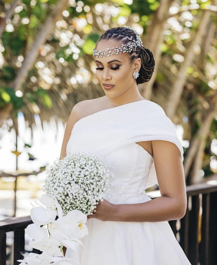 Bridal Sleek Cornrow Loc Chignon with Jeweled Forehead Crown that is among the 21 Wedding Loc Styles That Make You Look Like a Goddess