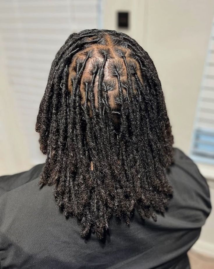 A LADY ON NEWLY RETWISTED LOCS