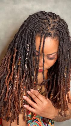 Natural flowing locs with light accessories