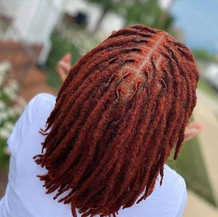 A LADY ON RED RETWISTED LOCS
