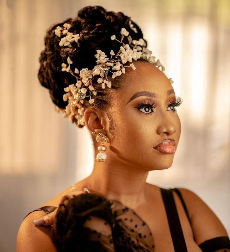 Sculpted bridal updo with pinned locs