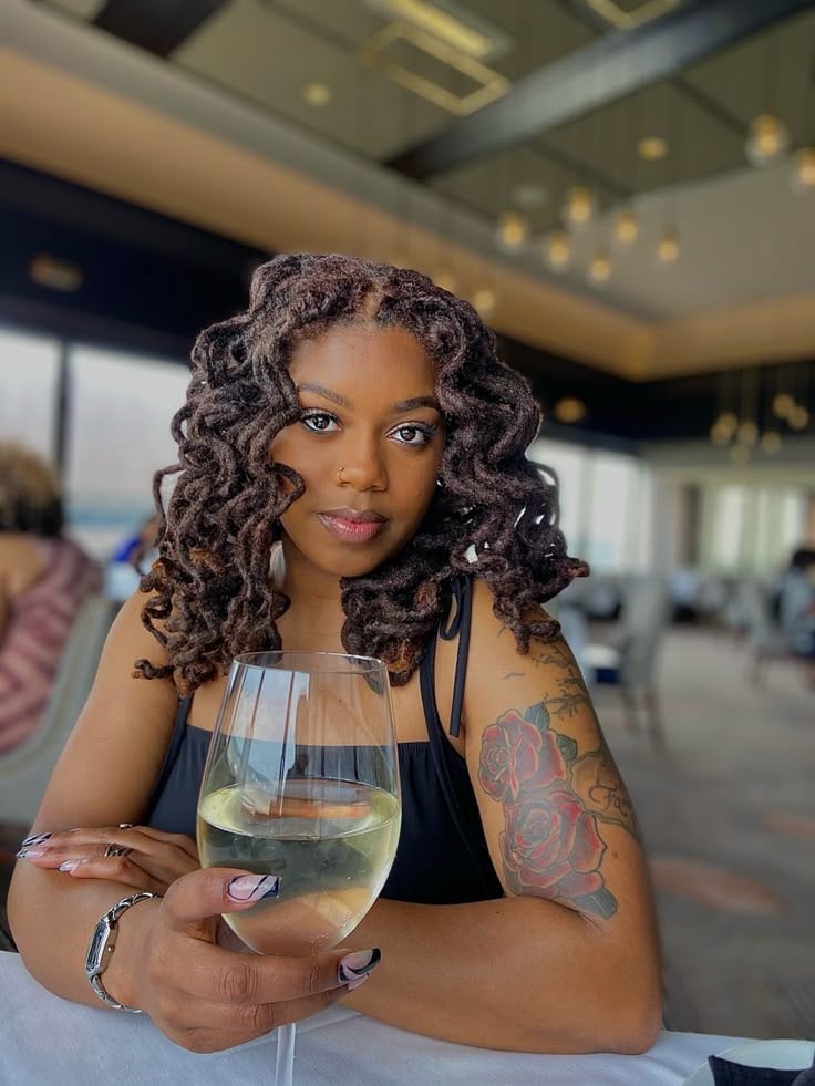 A LADY WITH CENTER PARTED LOCS