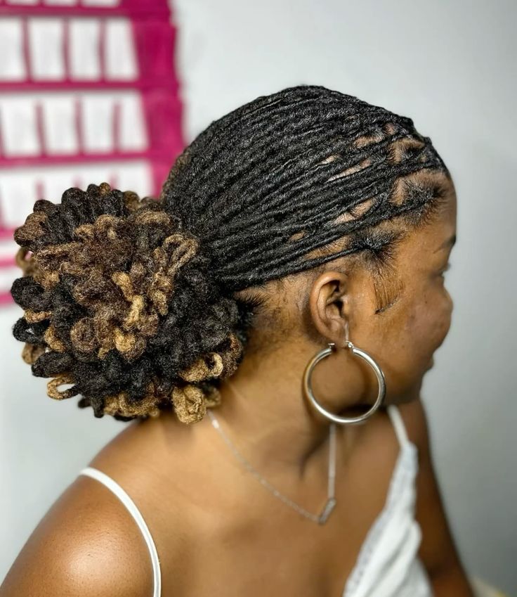 Sleek Low Bun with Face-Framing Locs
