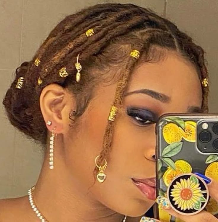 Locs with Gold Cuffs and Jewelry