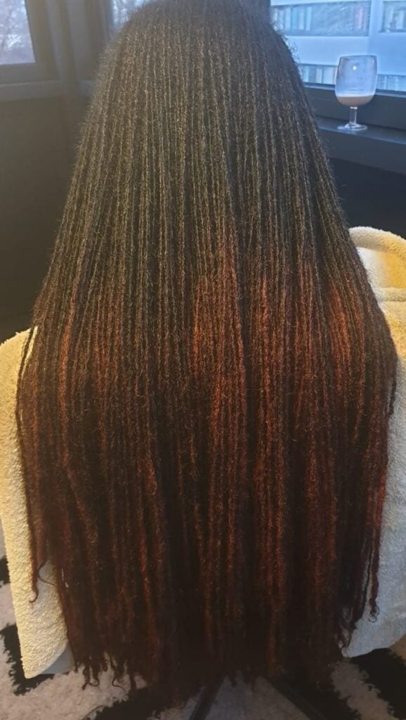 Waist-Length Straight Locs with Gold Accessories