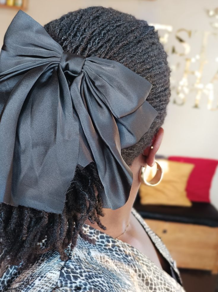 Low Loc Bun With a Satin Ribbon