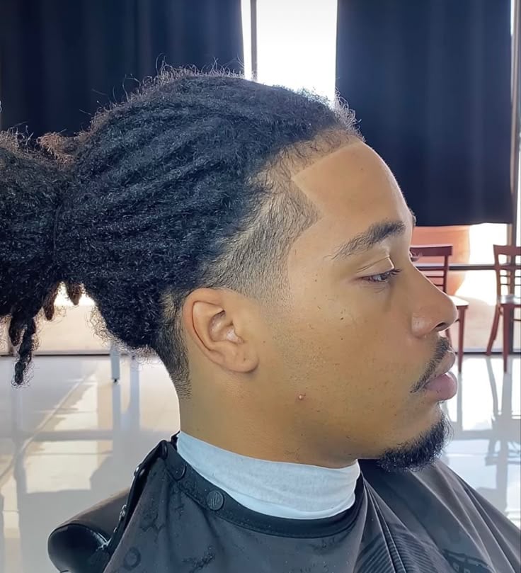 Medium-Length Locs With a Low Fade